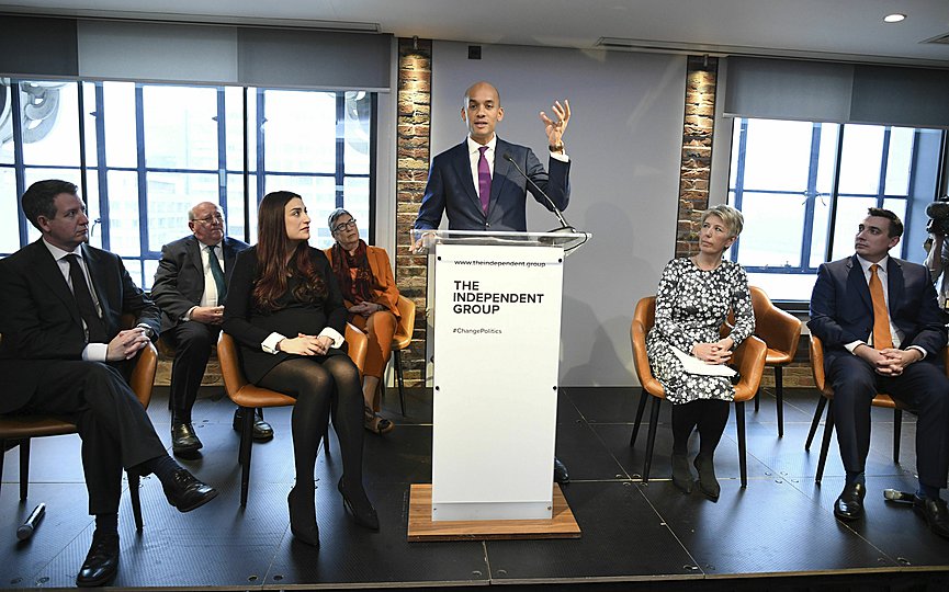 Labour MP Chuka Umunna, center, speaks to the media during a press conference with a group of six other Labour MPs, in London, Monday, Feb. 18, 2019. Seven British lawmakers say they are quitting the main opposition Labour Party over its approach to issues including Brexit and anti-Semitism. (Stefan Rousseau/PA via AP)