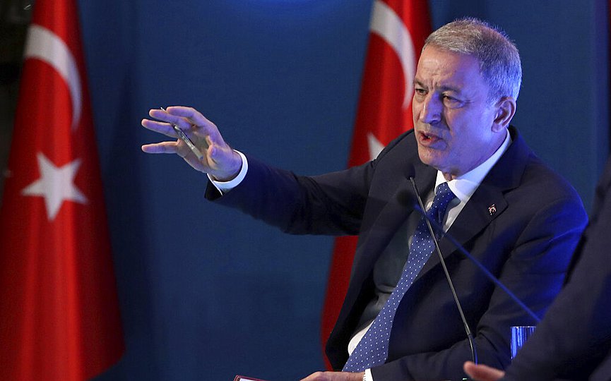FILE- Turkey's Defense Minister Hulusi Akar addresses a meeting of his country's ambassadors, in Ankara, Turkey, Wednesday, Aug. 7, 2019. (Turkish Defence Ministry via AP, Pool)