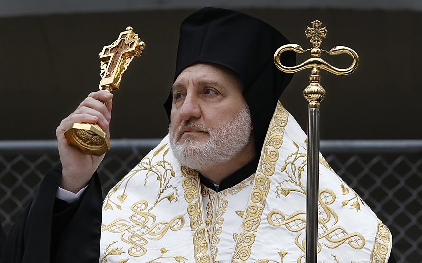 In this Dec. 6, 2019, photo, Greek Orthodox Archbishop Elpidophoros leads a celebration of St. Nicholas Day, at the St. Nicholas National Shrine at the World Trade Center in New York. (AP Photo/Mark Lennihan)