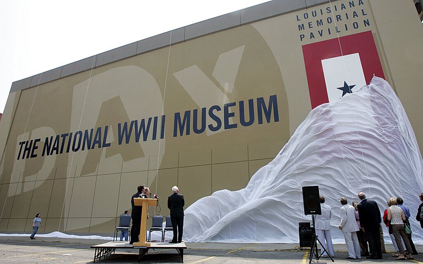 FILE- In this June 2, 2006 file photo, participants watch as the new name for the National D-Day Museum, The National World War II Museum, is unveiled in New Orleans. (AP Photo/Bill Haber, File)