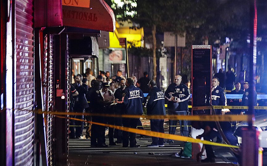 New York City police officers gather early Thursday, June 4, 2020, near the site of shooting Wednesday night in the Brooklyn borough of New York. (AP Photo/Frank Franklin II)