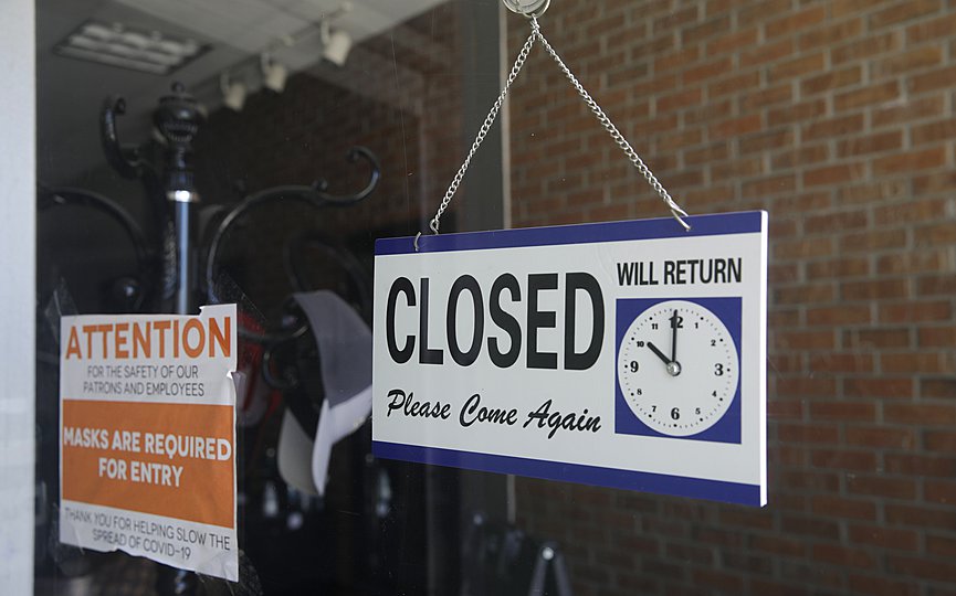 FILE - In this July 18, 2020 file photo a closed sign hangs in the window of a barber shop in Burbank, Calif. (AP Photo/Marcio Jose Sanchez, File)