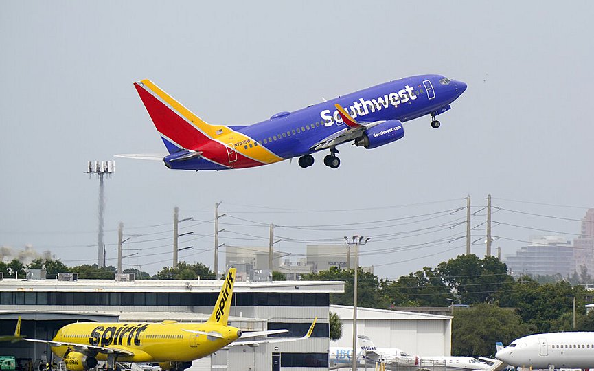 A Southwest Airlines Boeing 737-7H4 takes off, Tuesday, Oct. 20, 2020, from Fort Lauderdale-Hollywood International Airport in Fort Lauderdale, Fla. (AP Photo/Wilfredo Lee)