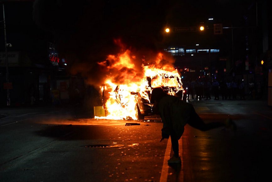 A police car burns during a protest in response to the police shooting of Walter Wallace Jr., late Monday, Oct. 26, 2020, in Philadelphia. (Jessica Griffin/The Philadelphia Inquirer via AP)