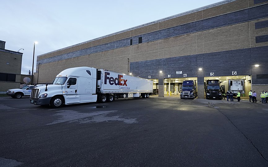A truck loaded with the Pfizer-BioNTech COVID-19 vaccine leaves the Pfizer Global Supply Kalamazoo manufacturing plant in Portage, Mich., Sunday, Dec. 13, 2020. (AP Photo/Morry Gash, Pool)