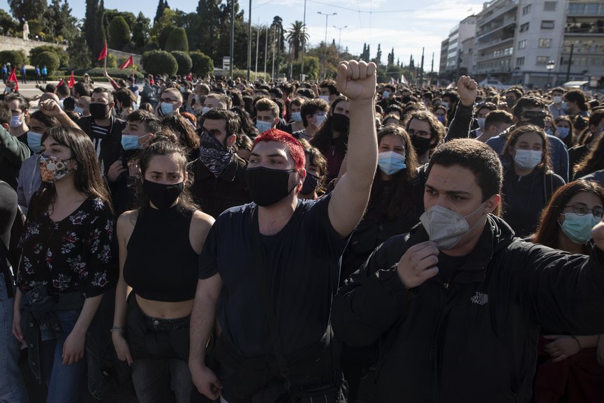 University students wearing face masks to protect against coronavirus, chant slogans as they take part in a rally against education reforms in Athens, Thursday, Feb. 4, 2021. (AP Photo/Petros Giannakouris)