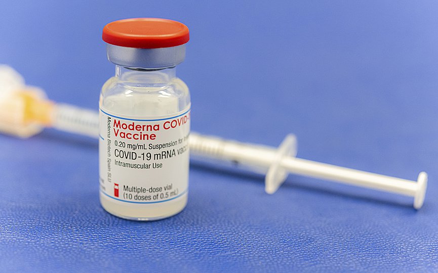 An ampoule Moderna vaccine against the COVID-19 disease, stand on the table at the Diakonie Hospital 