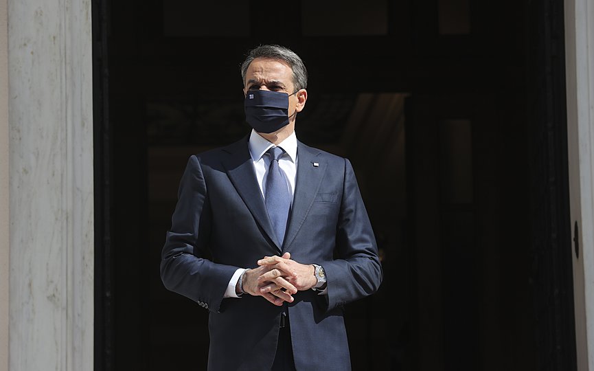 Greece s Prime Minister Kyriakos Mitsotakis waits for the arrival of the Russian Prime Minister Mikhail Mishustin at Maximos Mansion in Athens, Wednesday, March 24, 2021. (AP Photo/Petros Giannakouris)