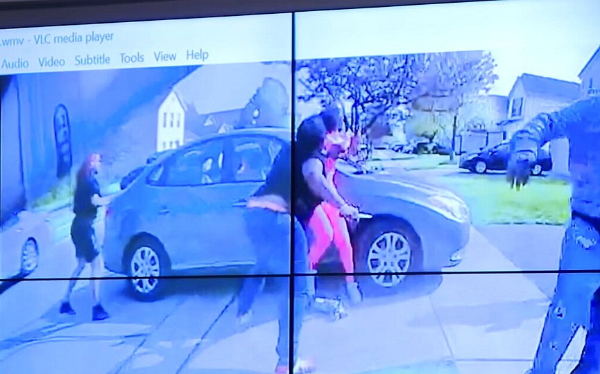 In an image from police bodycam video that the Columbus Police Department played during a news conference Tuesday night, April 20, 2021, a teenage girl, foreground, appears to wield a knife during an altercation before being shot by a police officer Tuesday, April 20, 2021, in Columbus, Ohio. (Columbus Police Department via WSYX-TV via AP)
