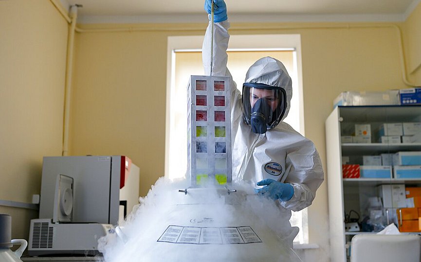FILE - In this Aug. 6, 2020, file photo provided by Russian Direct Investment Fund, an employee works with a coronavirus vaccine at the Nikolai Gamaleya National Center of Epidemiology and Microbiology in Moscow, Russia. (Alexander Zemlianichenko Jr/Russian Direct Investment Fund via AP, File)