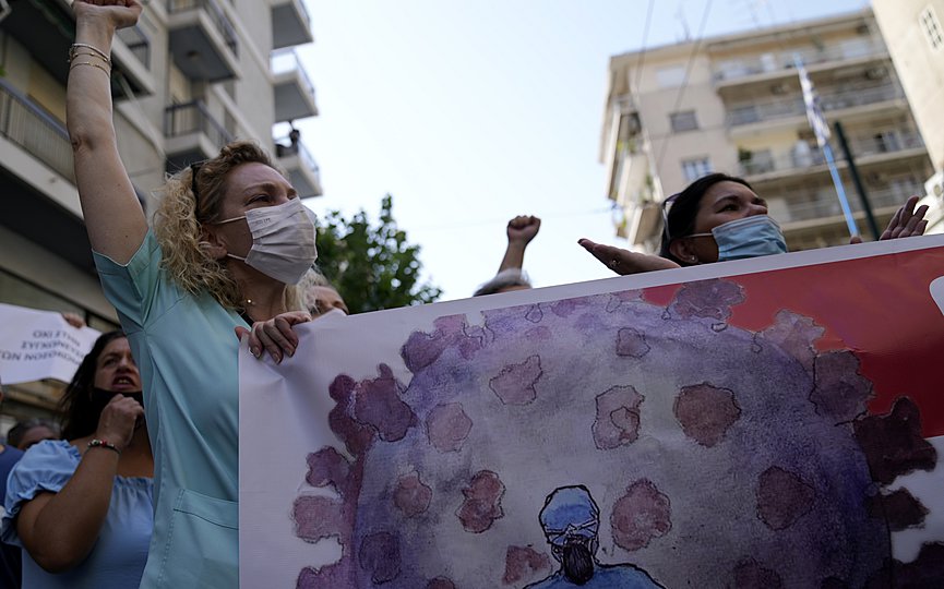 Health workers take part in a rally in Athens, Thursday, Aug. 26, 2021. (AP Photo/Thanassis Stavrakis)