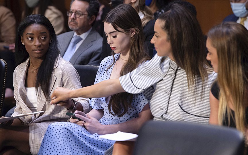 United States gymnasts from left, Simone Biles, McKayla Maroney, Aly Raisman and Maggie Nichols, arrive to testify during a Senate Judiciary hearing about the Inspector General s report on the FBI s handling of the Larry Nassar investigation on Capitol Hill, Wednesday, Sept. 15, 2021, in Washington. (Saul Loeb/Pool via AP)