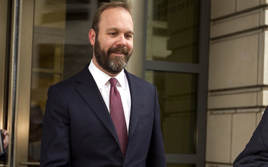 FILE - In this Feb. 23, 2018, file photo, Rick Gates leaves federal court in Washington. Paul Manafort’s trial opened this week with a display of his opulent lifestyle and testimony about what prosecutors say were years of financial deception. But the most critical moment in the former Trump campaign chairman’s financial fraud trial will arrive next week with the testimony of his longtime associate Gates.(AP Photo/Jose Luis Magana, File)