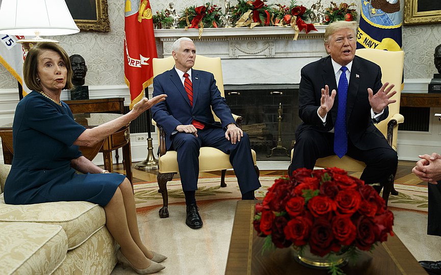 FILE - Vice President Mike Pence, center, looks on as House Minority Leader Rep. Nancy Pelosi, D-Calif., argues with President Donald Trump during a meeting in the Oval Office of the White House, Tuesday, Dec. 11, 2018, in Washington. (AP Photo/Evan Vucci)