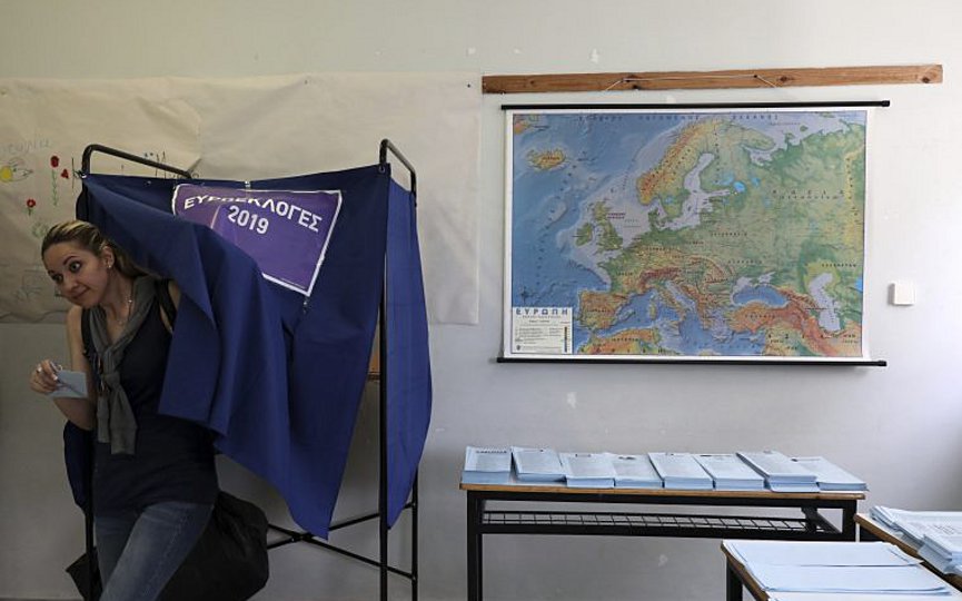 A woman casts her vote at a polling station in Athens on Sunday, May 26, 2019. Polls opened early Sunday in Greece, with nearly 10 million registered voters called upon to vote for the European Parliament, regional and local councils in 39,063 polling stations across the country. (AP Photo/Yorgos Karahalis)