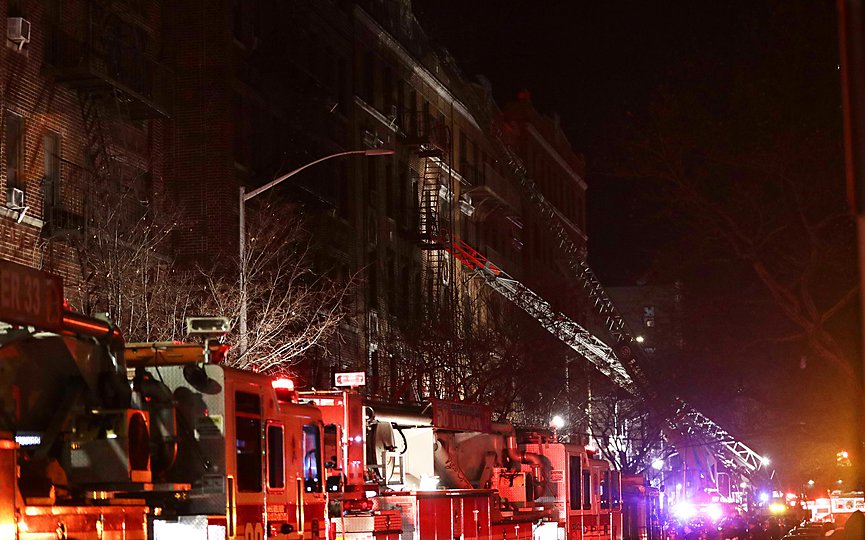 FILE - Firefighters respond to a building fire Thursday, Dec. 28, 2017, in the Bronx borough of New York. (AP Photo/Frank Franklin II)