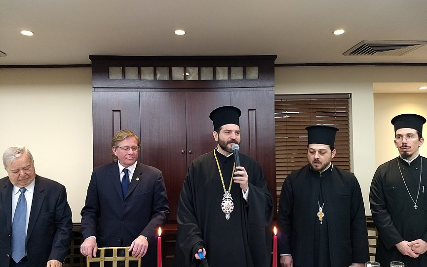 His Grace Bishop Apostolos of Medeia presides over the cutting of the Vasilopita. Left to right: Archon of the Ecumenical Patriarchate John Volandes, President of the Board of Trustees Haralambos Paloumbis, Bishop Apostolos of Medeia, Dean of Sts. Constantine and Helen Cathedral Fr. Evagoras Constantinides, and Fr. Eugene Georgantakis. (Photo: TNH/Michalis Kakias)